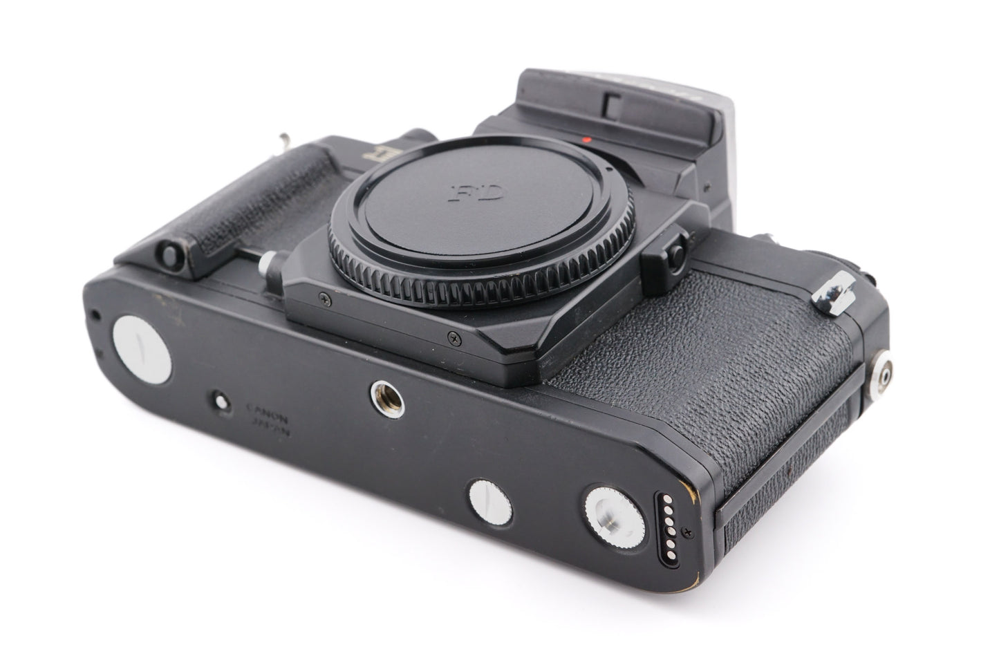 A close-up of aftermarket coupler / socket cover set installed on a camera body on a white background. For Canon New F-1.