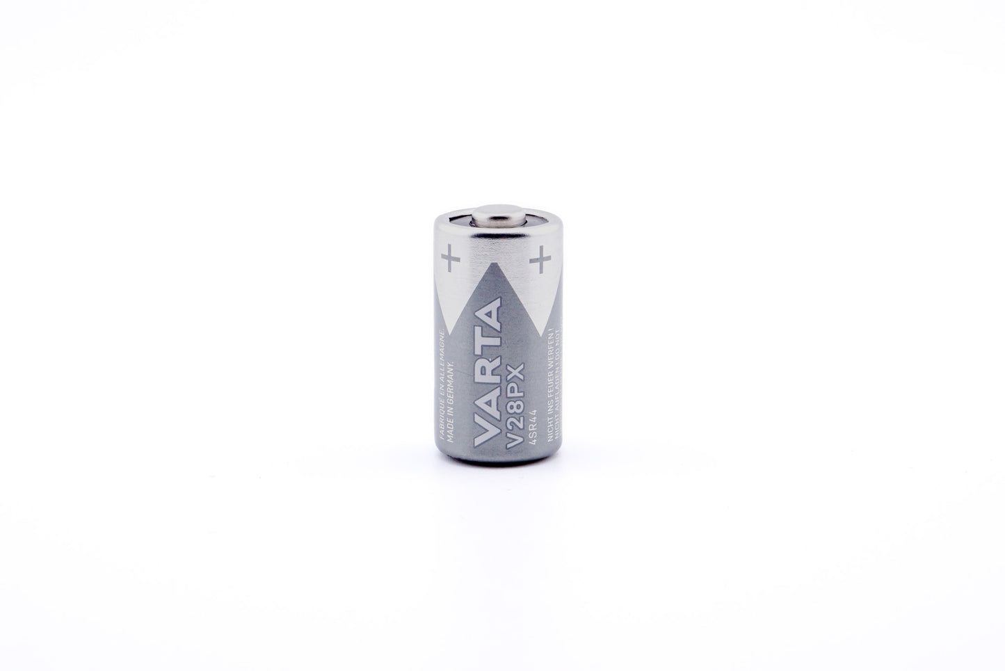 A battery on a white background. A battery in a package on a white background. Varta 4SR44 6.2V.