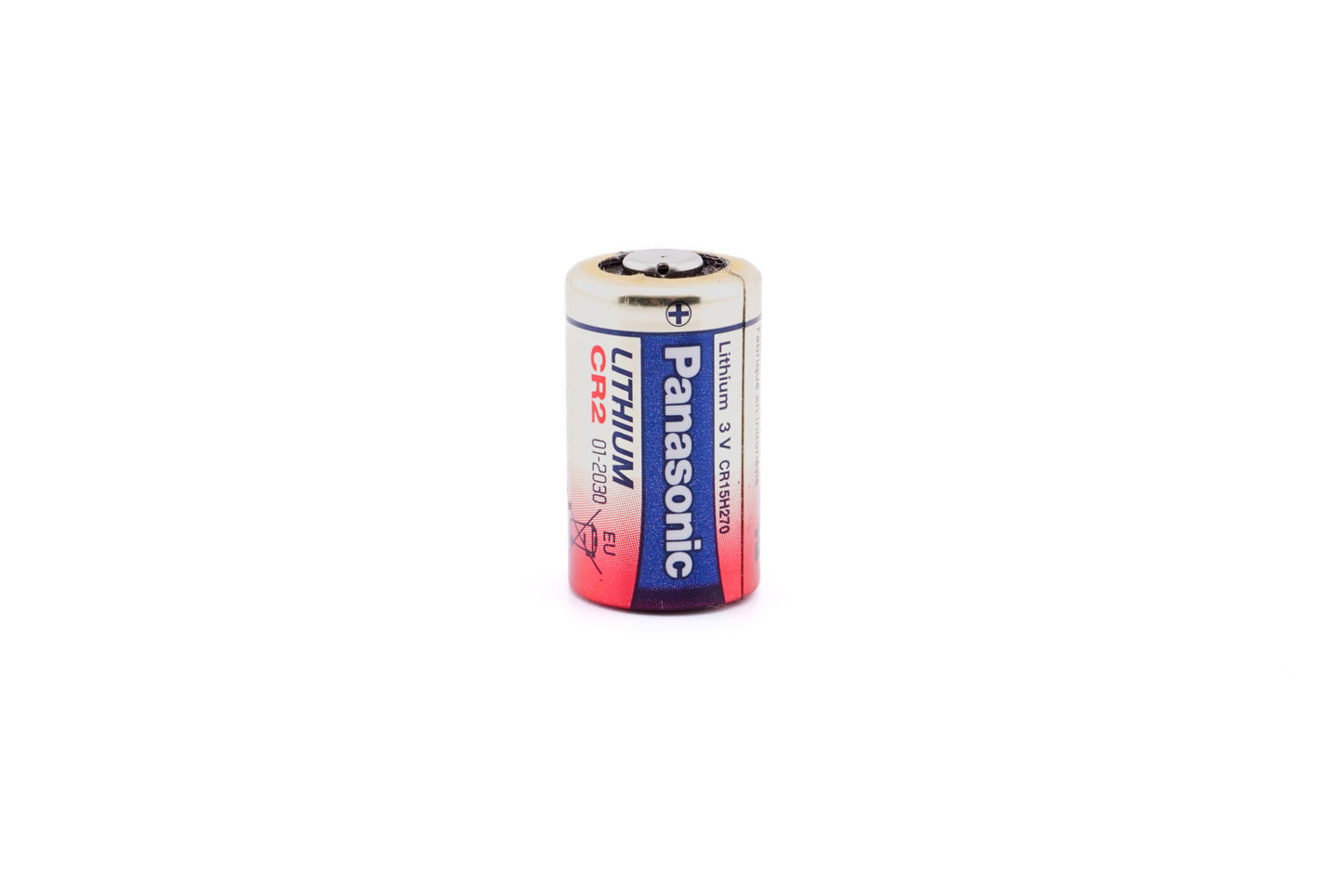 A close-up of a battery on a white background. A battery in a package on a white background. Panasonic CR2 3V.