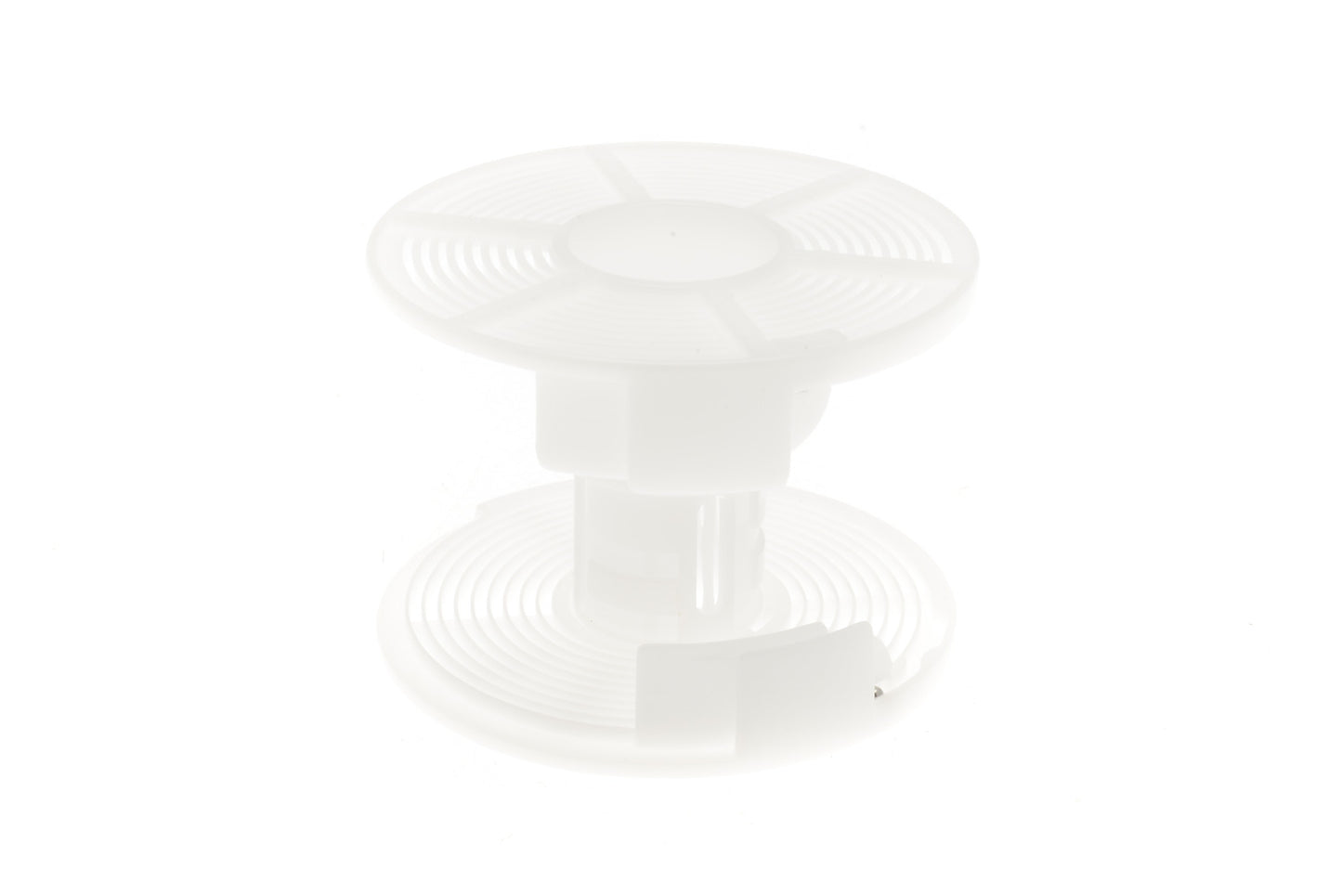 A plastic reel for developing film on a white background.