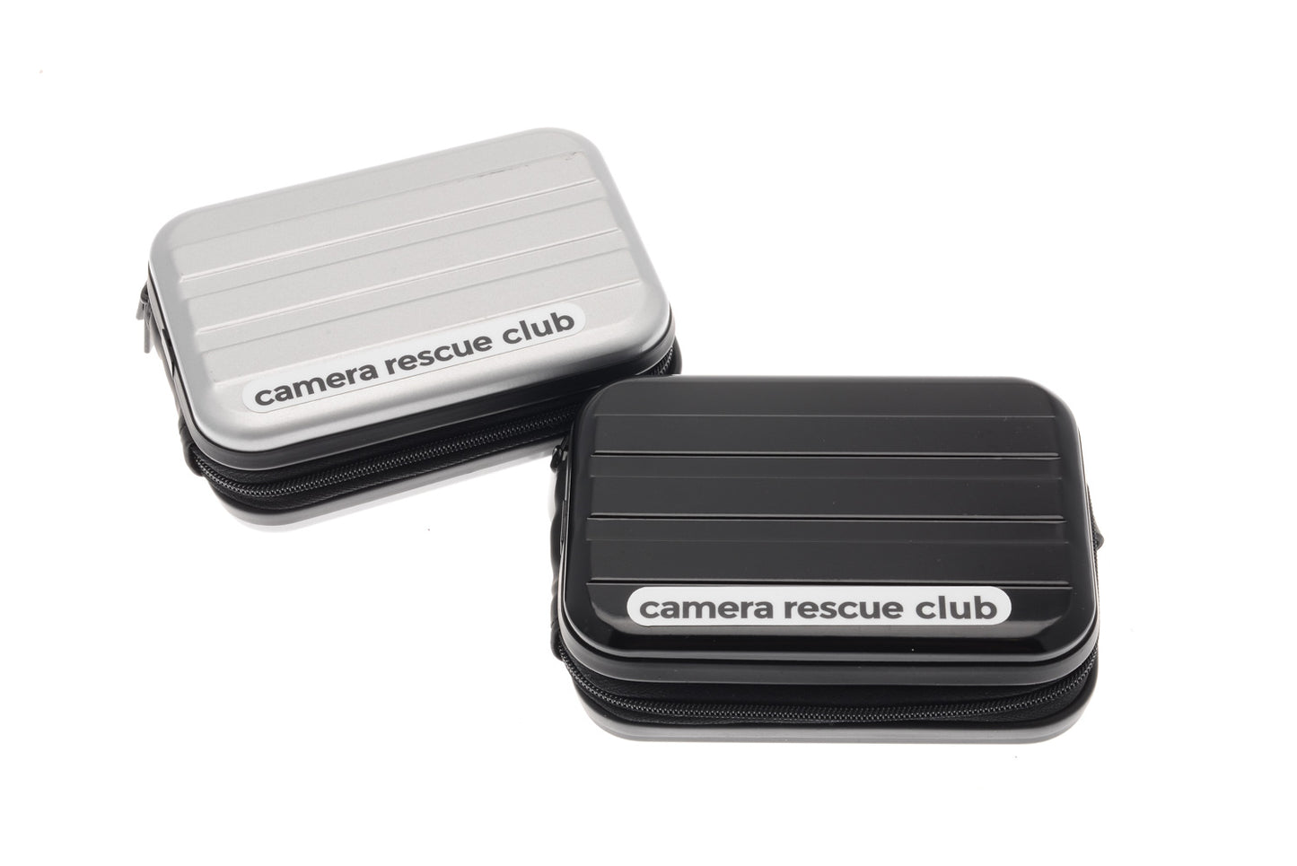 Camera Rescue Club cases in black and silver with a film roll and a carabiner.