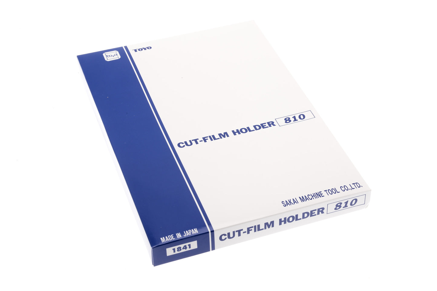 A package of cut-film holder on a white background. Toyo 8x10".