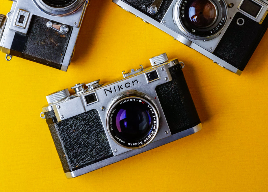 Nikon S rangefinder cameras on table