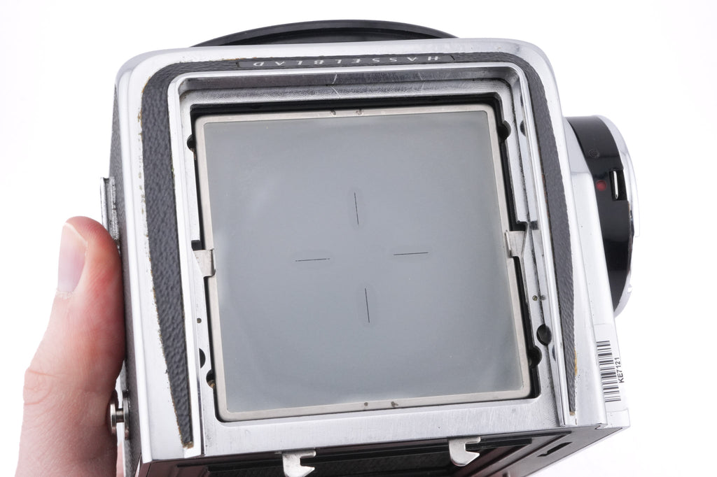 Hasselblad 500C/M (Silver, 10026) + Rapid Winding Crank (Chrome, 44016/TIRFC) + Standard Focusing Screen (42161) + A12 Film Magazine (Silver, 30074) + Waist Level Finder (Old / Silver, 42021)