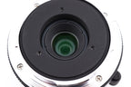 A close-up of 7Artisans 28mm lens rear on a white background.