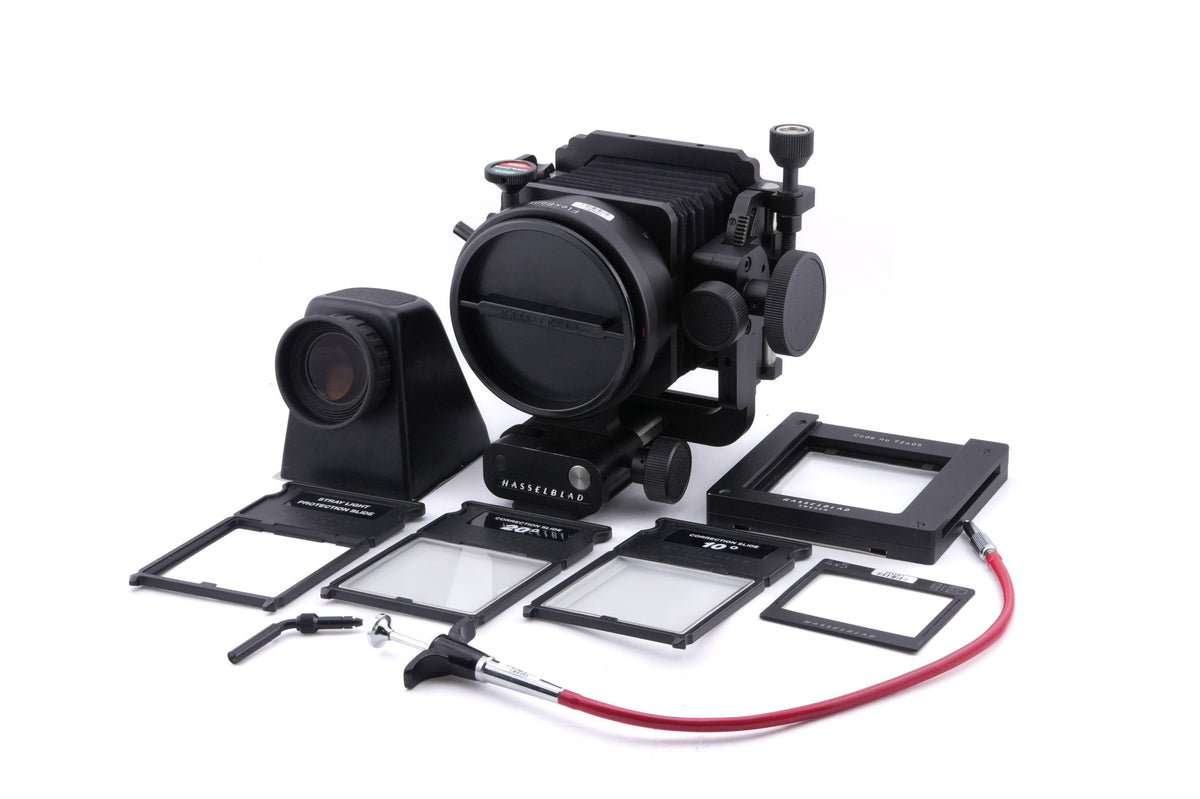 Hasselblad FlexBody (72109) + Stray Light Protection Slide (72411) + Film Format 4x5 Mask  (41151) + Open L-Connector (50776) + Focusing Screen Adapter (72405) + Reflex Viewfinder RMfx (72530) + FlexBody Cable Release (72513) + 10° Correction Slide (72413