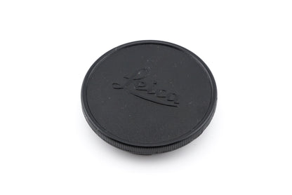 Front view of Leica lens cap with leica script embossed in center