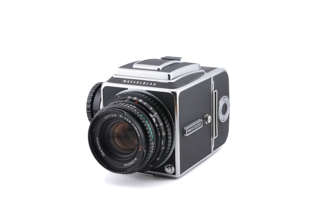 Hasselblad 500C/M (Silver, 10026) + A12 Film Magazine (Silver, 30074) + Waist Level Finder (New / Chrome, 42315) + Standard Focusing Screen (42161) + 80mm f2.8 Opton PL T*