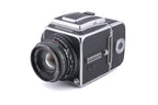 Hasselblad 500C/M (Silver, 10026) + 80mm f2.8 Planar T* C (Black, 20028) + A12 Film Magazine (Silver, 30074) + Waist Level Finder (New / Chrome, 42315) + Lens Shade 80 (40118/SEMOC) + Acute Matte Focusing Screen (42165) + Checked Screen (42072/TILMC)