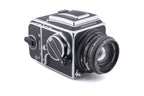 Hasselblad 500C/M (Silver, 10026) + 80mm f2.8 Planar T* C (Black, 20028) + A12 Film Magazine (Silver, 30074) + Waist Level Finder (New / Chrome, 42315) + Lens Shade 80 (40118/SEMOC) + Acute Matte Focusing Screen (42165) + Checked Screen (42072/TILMC)