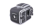 Hasselblad 500C/M (Silver, 10026) + 80mm f2.8 Planar T* C (Black, 20028) + A12 Film Magazine (Silver, 30074) + Waist Level Finder (New / Chrome, 42315) + Lens Shade 80 (40118/SEMOC) + Acute Matte Focusing Screen (42165) + Checked Screen (42072/TILMC)