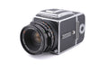 Hasselblad 500C/M (Silver, 10026) + 80mm f2.8 Planar T* CF (20029) + A12 Film Magazine (Silver, 30074) + Checked Focusing Screen with Central Grid (42250) + Waist Level Finder (Old / Silver, 42021)