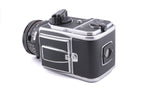 Hasselblad 500C/M (Silver, 10026) + 80mm f2.8 Planar T* CF (20029) + A12 Film Magazine (Silver, 30074) + Checked Focusing Screen with Central Grid (42250) + Waist Level Finder (Old / Silver, 42021)