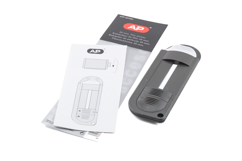 A handheld plastic device with instructions on a white background. For 35mm film canister.