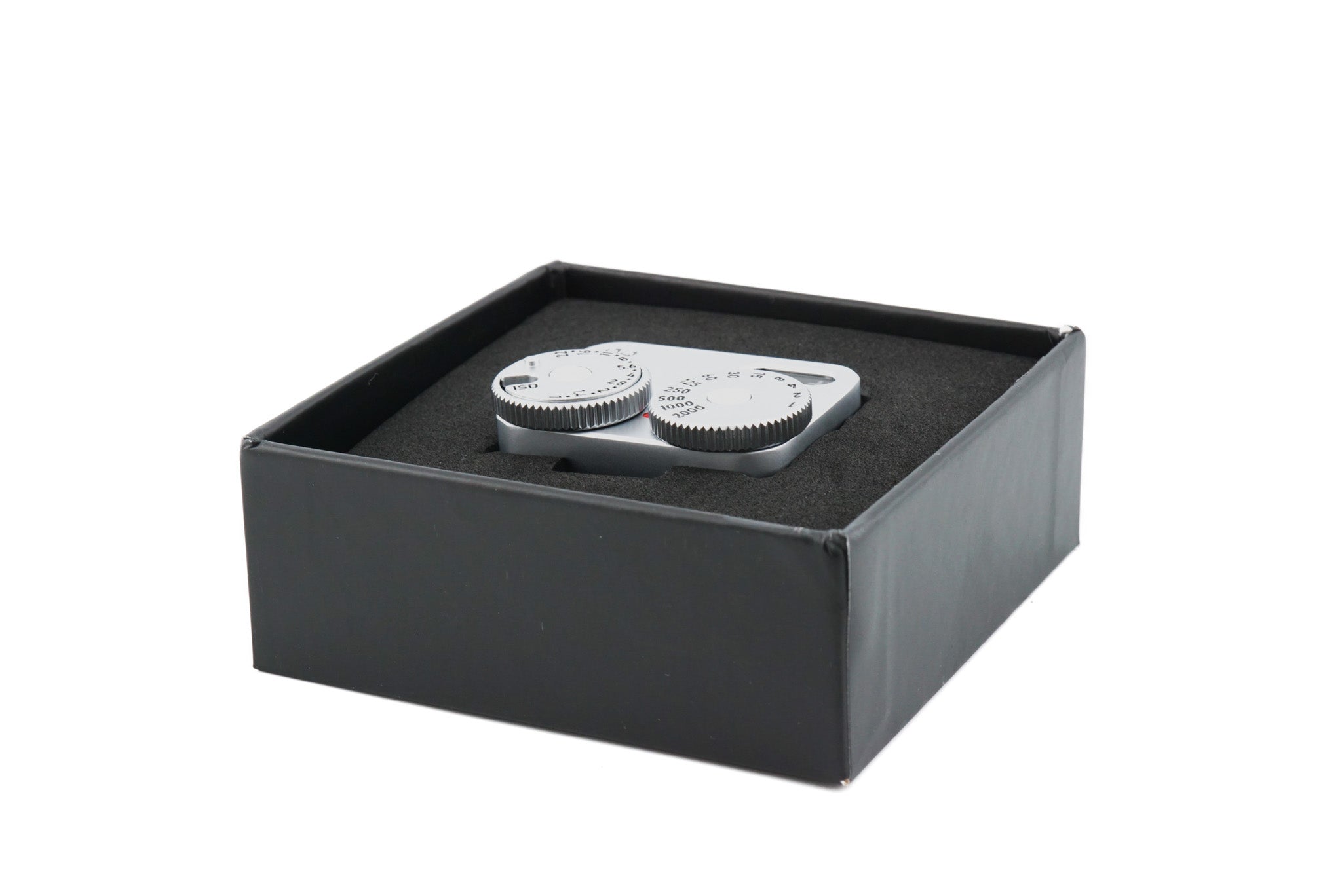 Doomo Meter D hot shoe chrome light meter in open box with white background.
