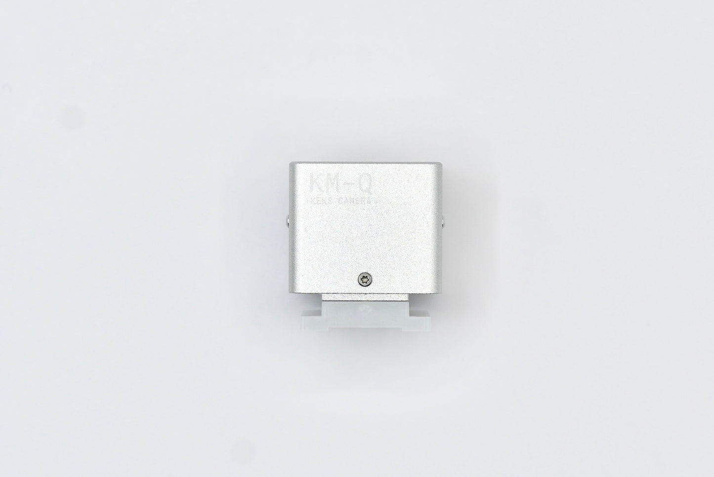 The KMQ chrome top display model from backside on a white background.