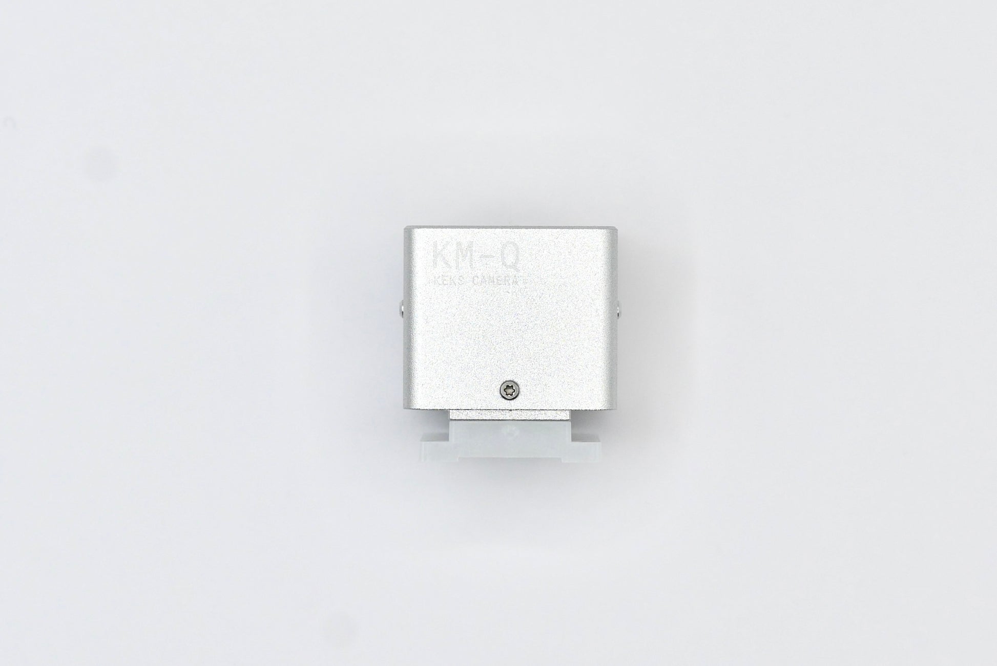 The KMQ chrome top display model from backside on a white background.