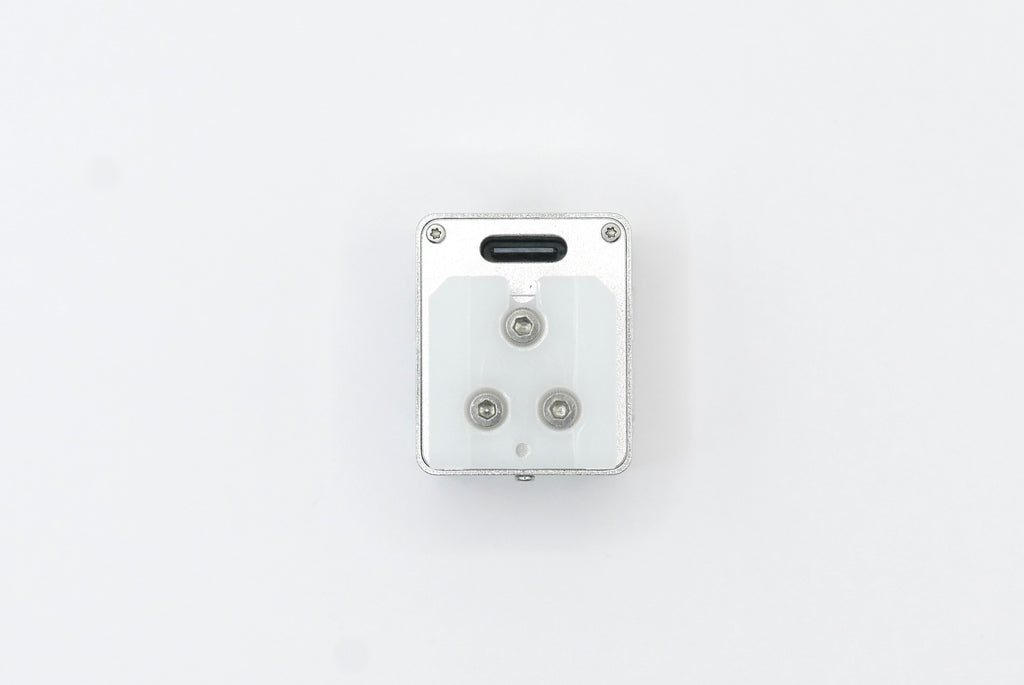 The KMQ chrome model from bottomside on a white background.