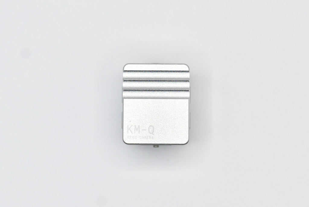 The KMQ chrome back display model from topside on a white background.