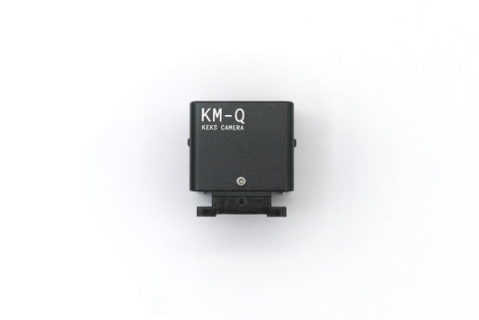 The KMQ black top display model from backside on a white background.