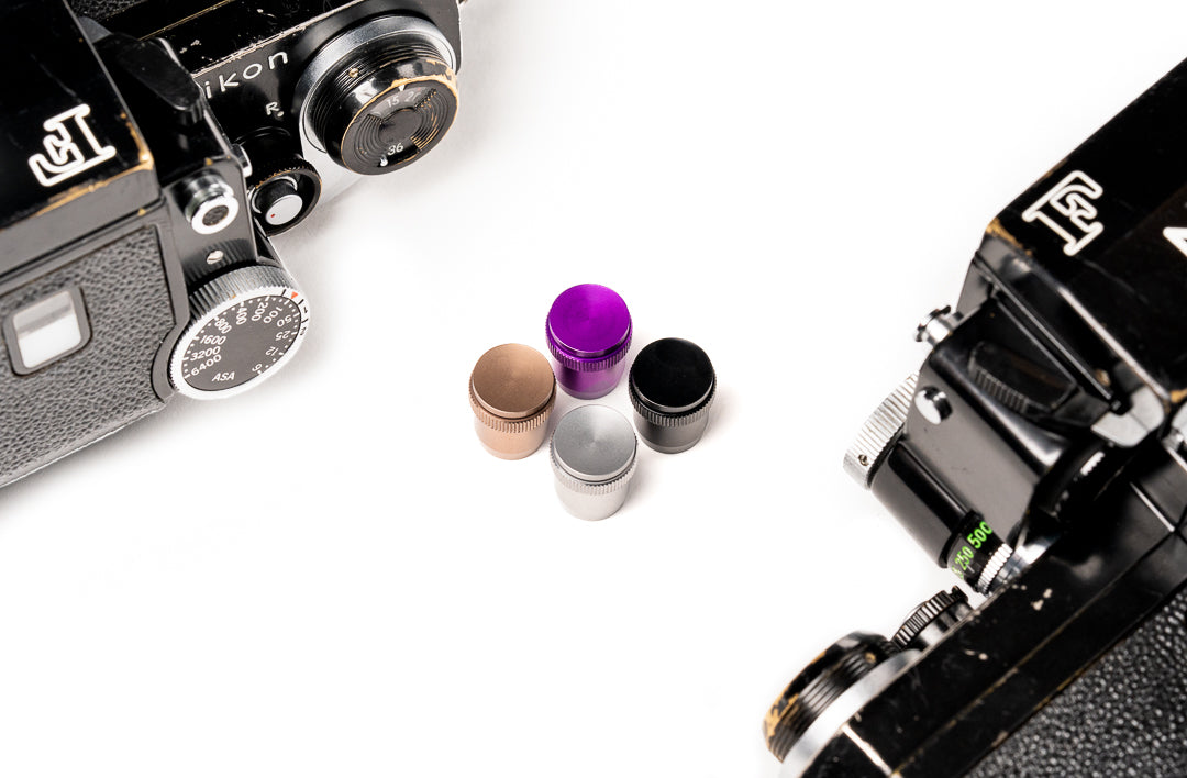 A set of soft release button surrounded by cameras. For Nikon AR-1.