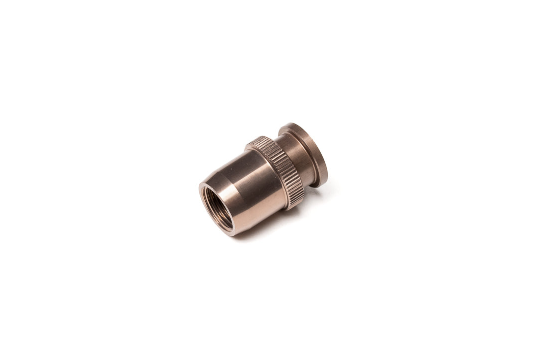 A bronze soft release button from side on a white background. For Nikon AR-1.