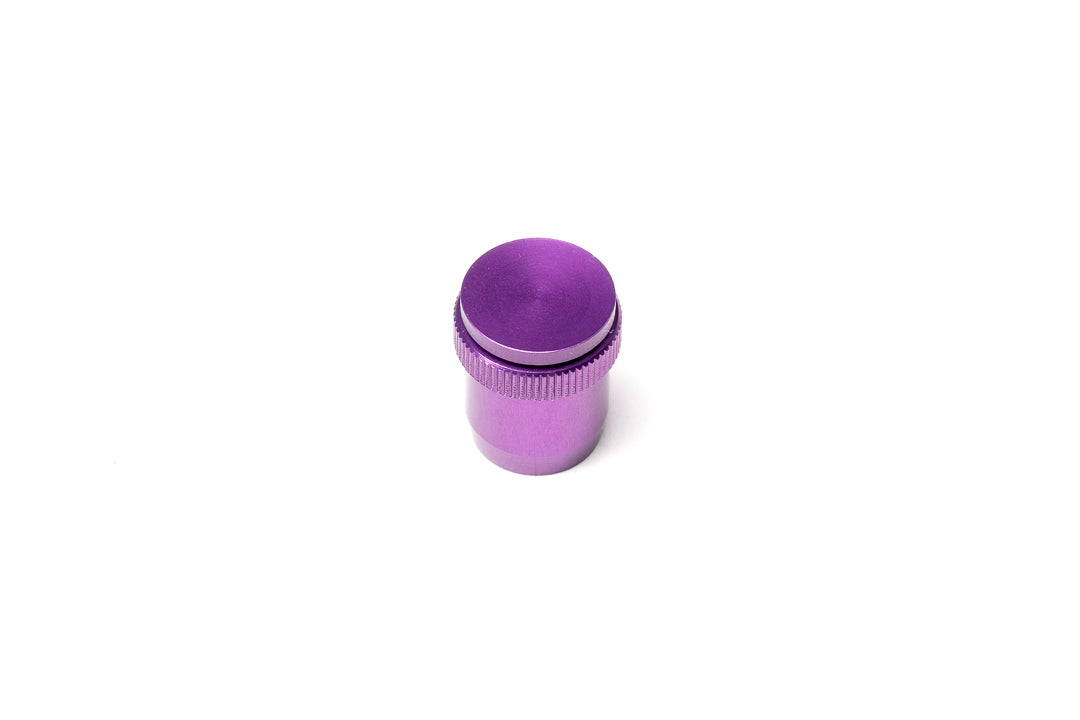 A purple soft release button on a white background. For Nikon AR-1.