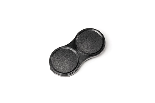 A black plastic lens cap for TLR camera lenses. Bay 1 I Lens Cap for Rolleicord Rolleiflex Cameras.