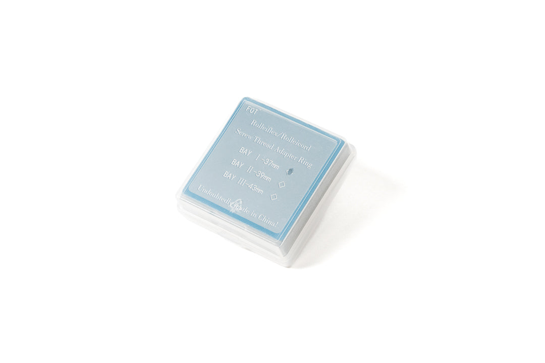 A 37mm metal adapter with UV filter in a package. 