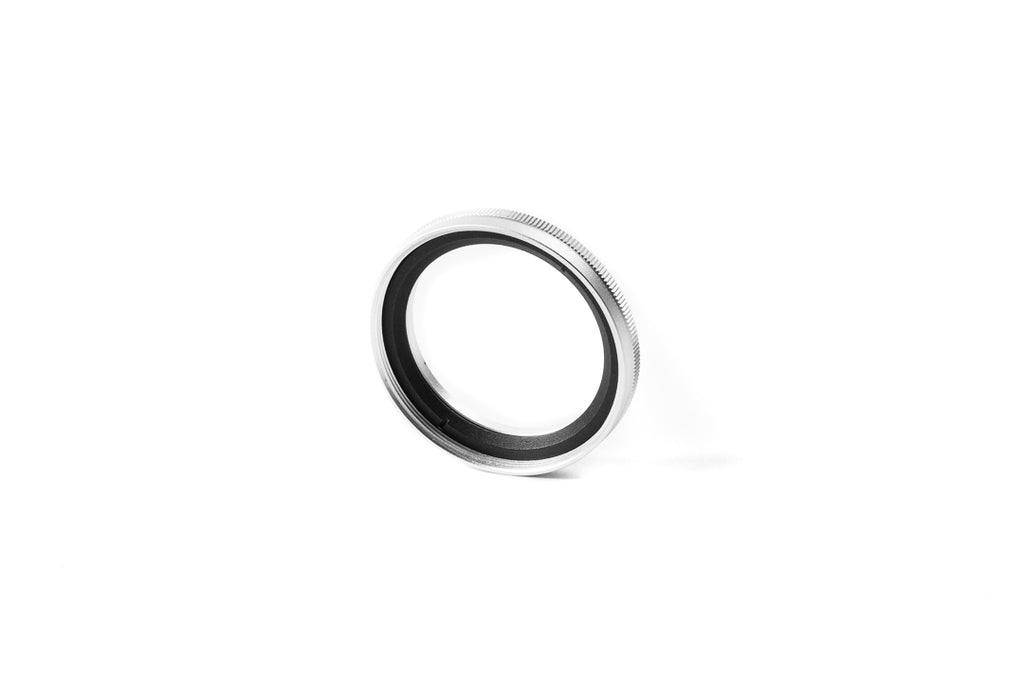A close-up of 37mm metal adapter on a white background.  