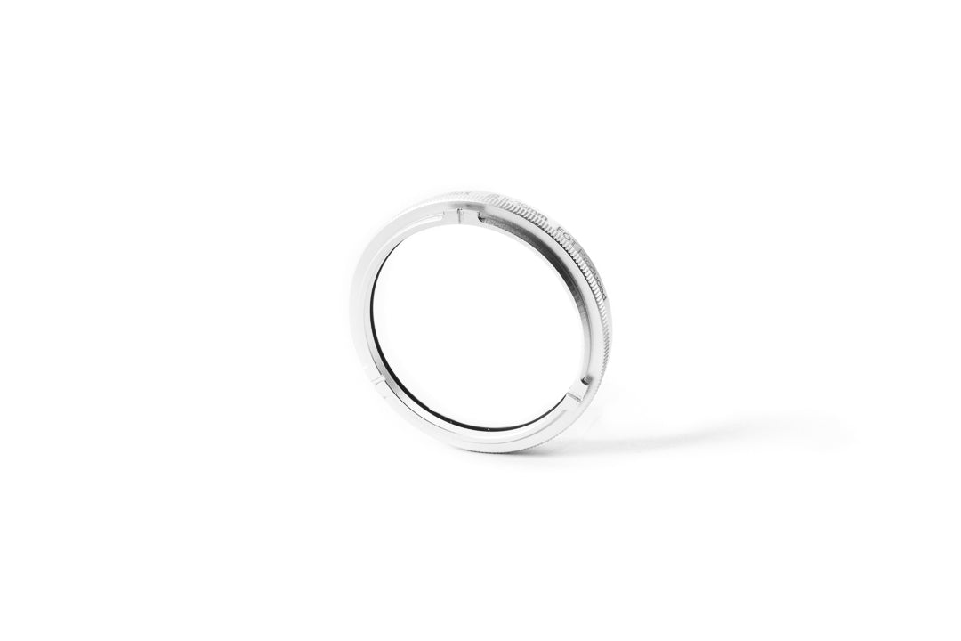 A close-up of 39mm metal adapter on a white background.  