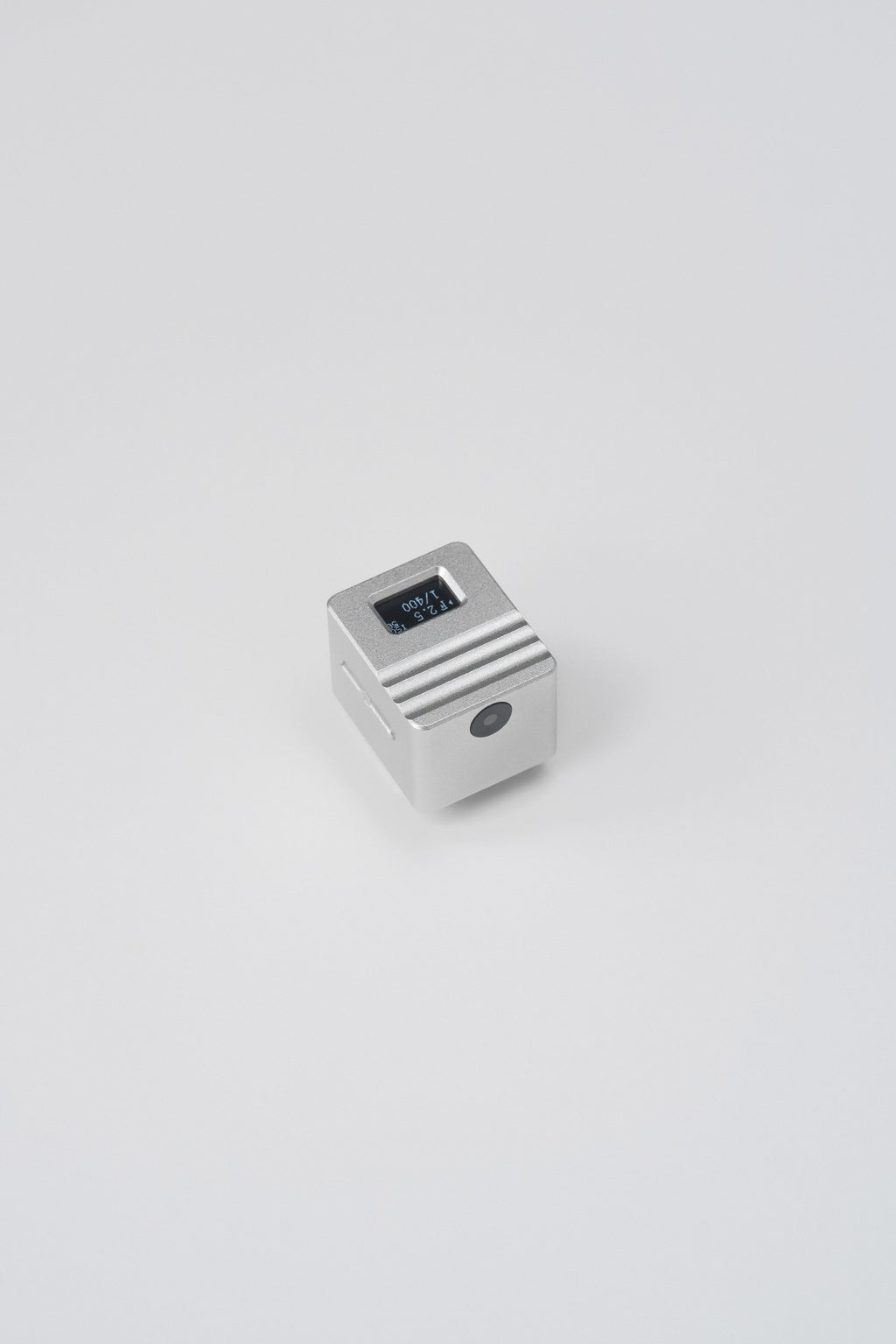 The KMQ chrome top display model from afar on a white background.