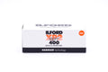 An Ilford XP2 Super 400 black and white film box on a white background. For 120mm medium format cameras.
