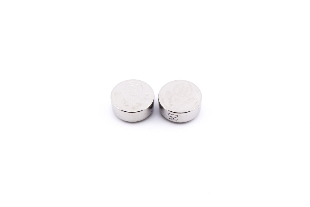 A close-up of batteries on a white background. Varta 2x LR44 / V13GA.