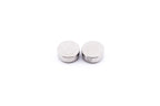 A close-up of batteries on a white background. Varta 2x LR44 / V13GA.