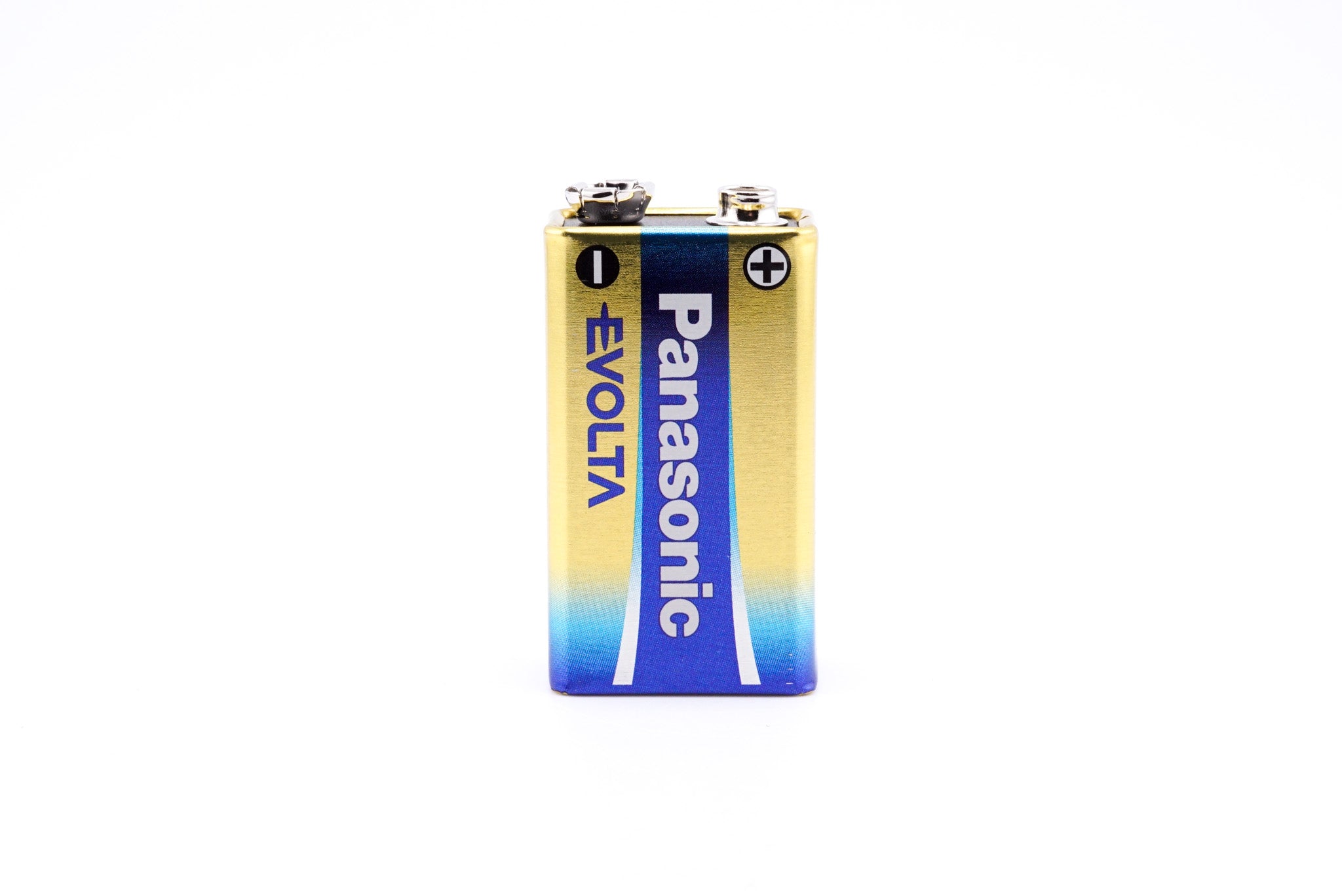 A close-up of a battery on a white background. Panasonic 6LR61 9V.