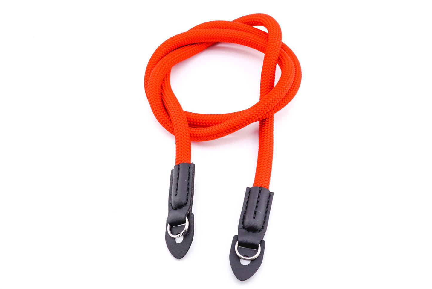 A red rope camera strap on a white background.