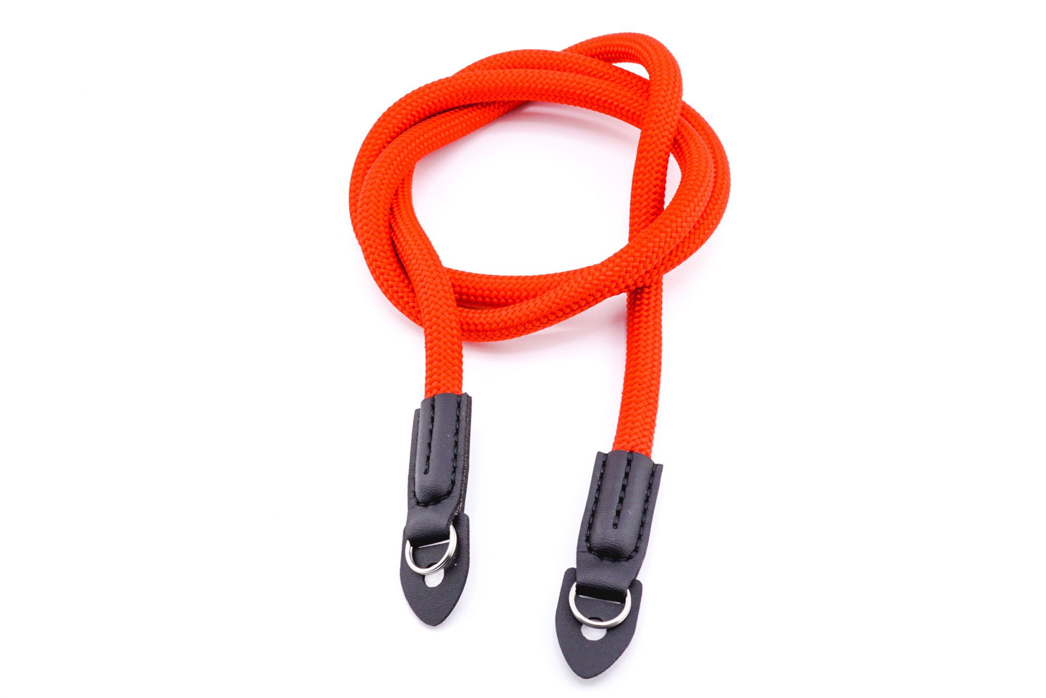 A red rope camera strap on a white background.