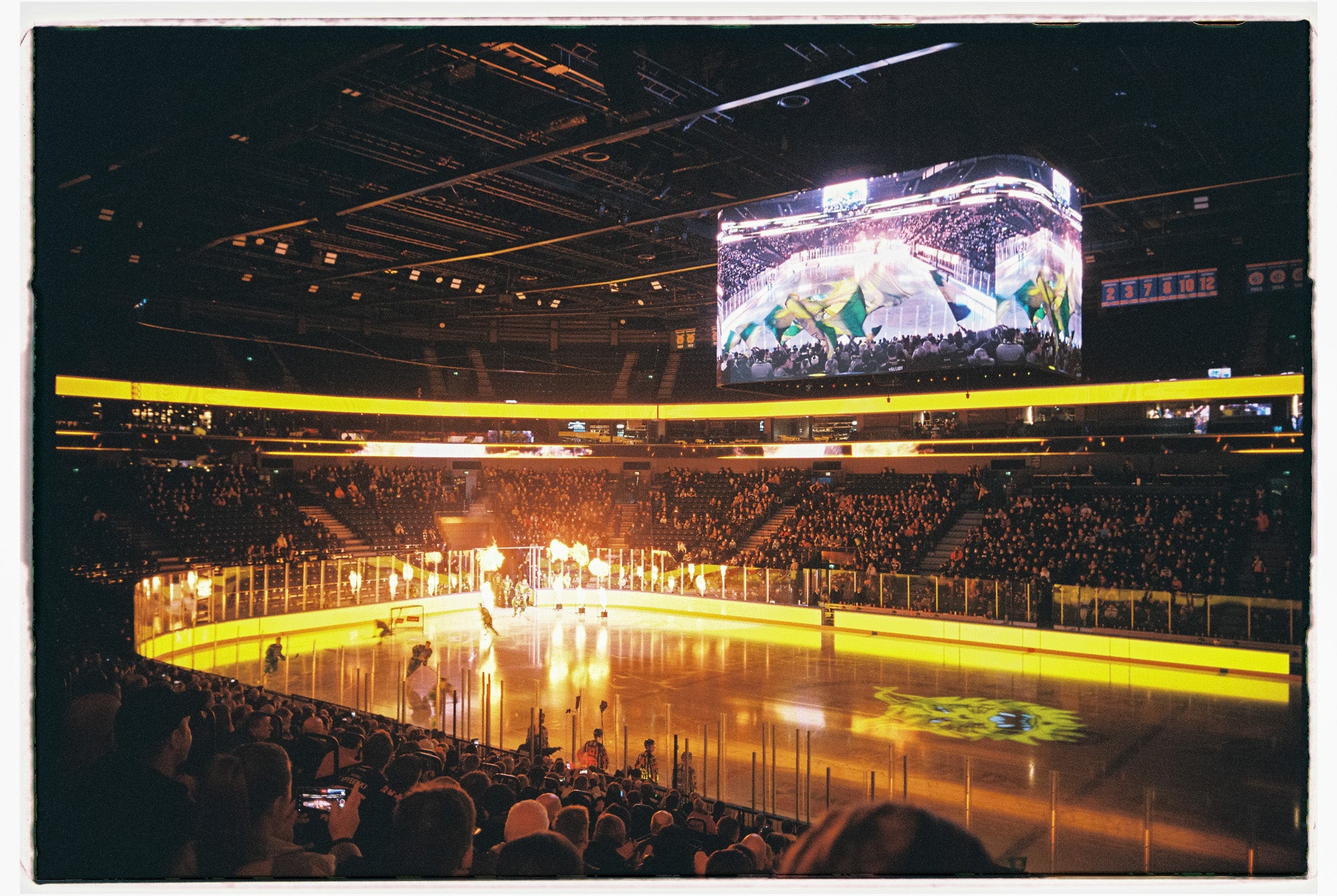 A hockey stadium with ice, fireworks and a big screen. A Kodak Ultramax 400.