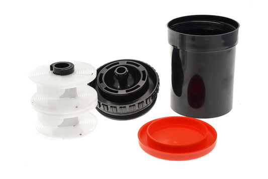 An opened light tight plastic developing tank with 2 reels. Both reels are adjustable to 35mm or 120mm. 