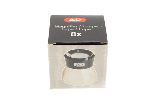 An 8x loupe for viewing negatives or slides in a package on a white background.