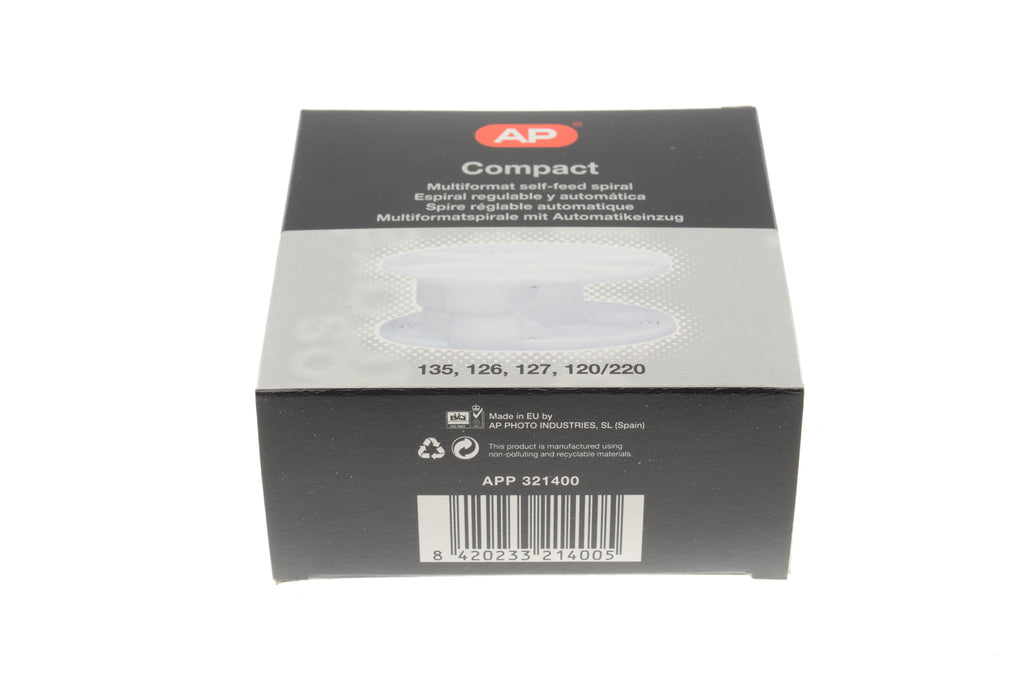 A plastic reel film developer in a package. For 35mm, 126mm, 127mm and 120/220 film.