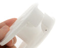 A close-up of a plastic reel film developer on a white background. 