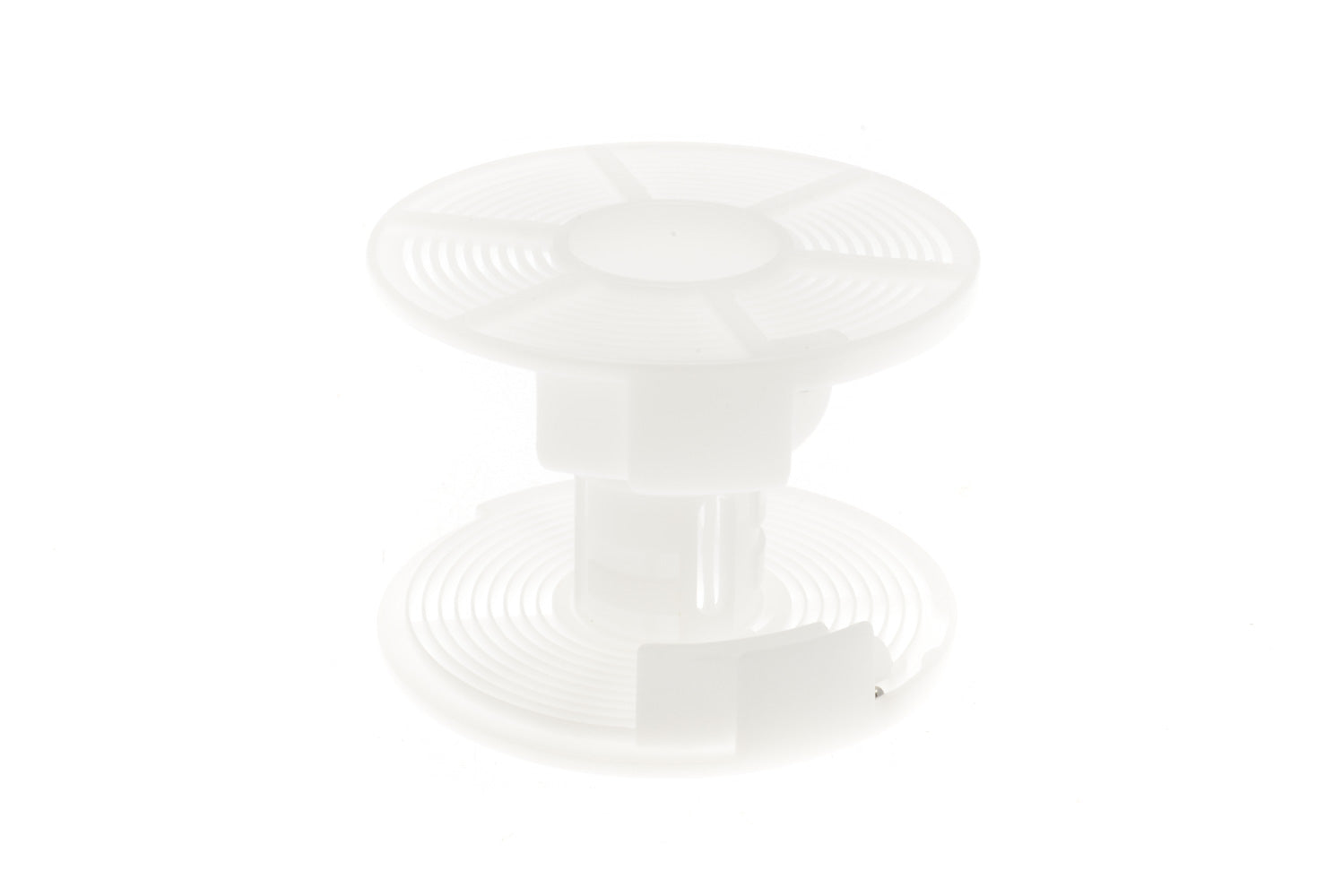 A plastic reel for developing film on a white background.