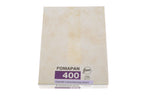 A Foma Fomapan 400 4x5" black and white sheet film package on a white background. 50 sheets in box.