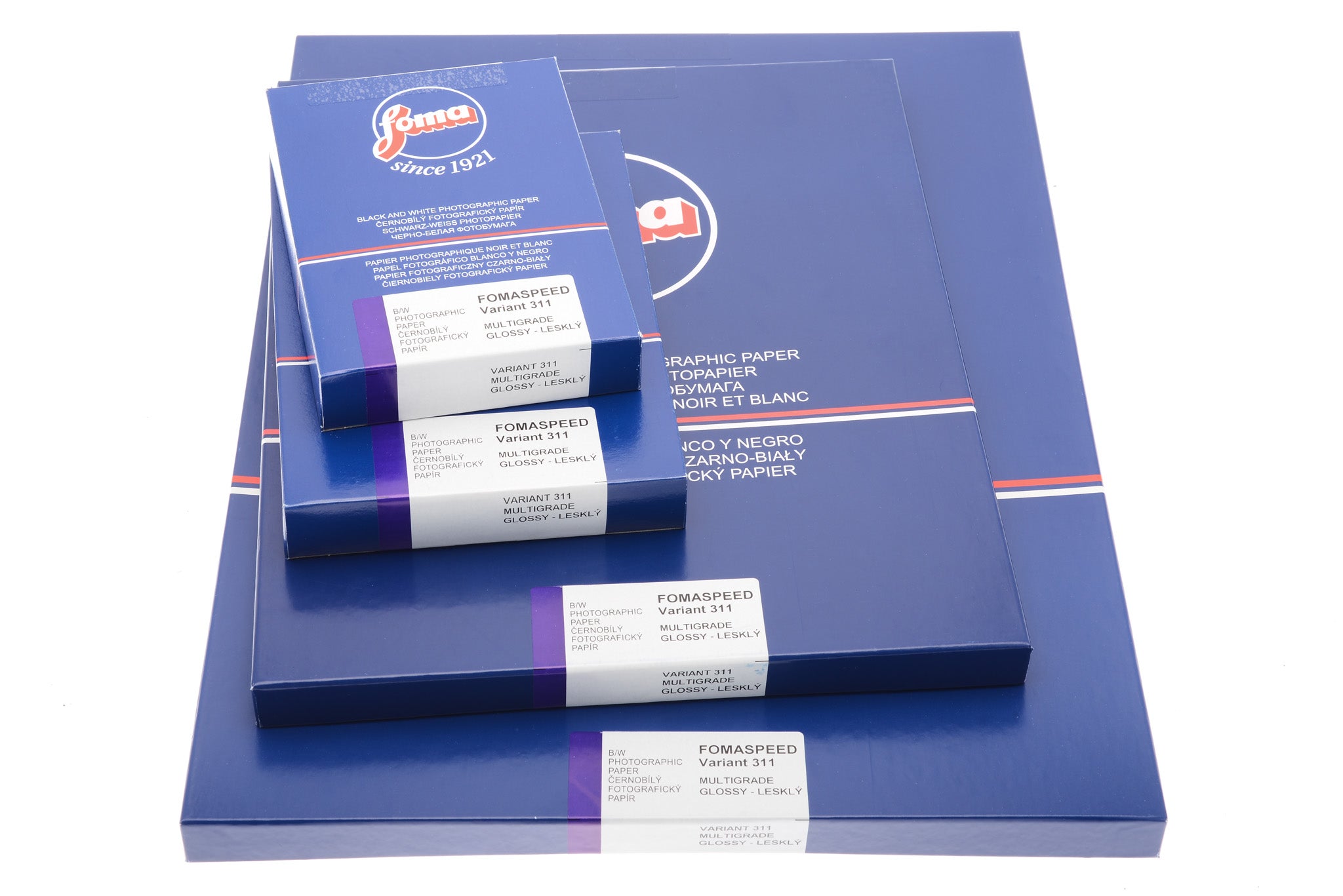 Different-sized Foma Fomaspeed glossy photographic paper sheet boxes on a white background. 50 Sheets per box.