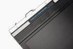 A close-up of a film holder on a white background. Toyo 8x10".